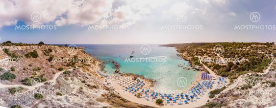 Panorama of the beach. Sea, beach umbrellas.