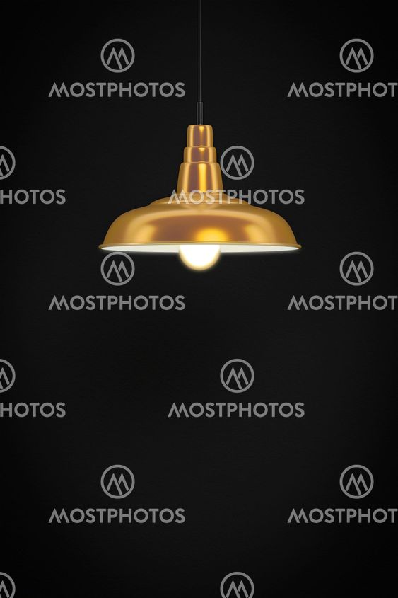 golden lamp in front of a dark wall