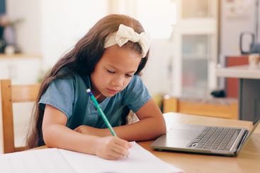 Girl, learning and writing with pencil, homework and...