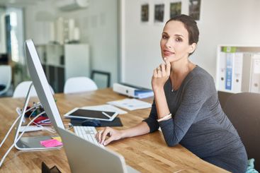Pregnant, computer and portrait of businesswoman in...