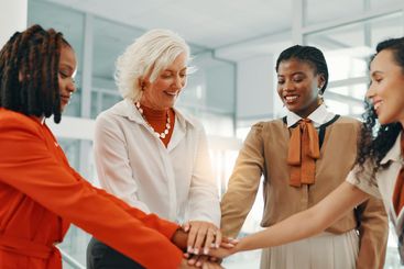 Hands together, teamwork and bonus with business women...