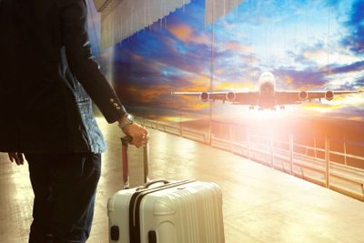 business man and traveling luggage in airport terminal...