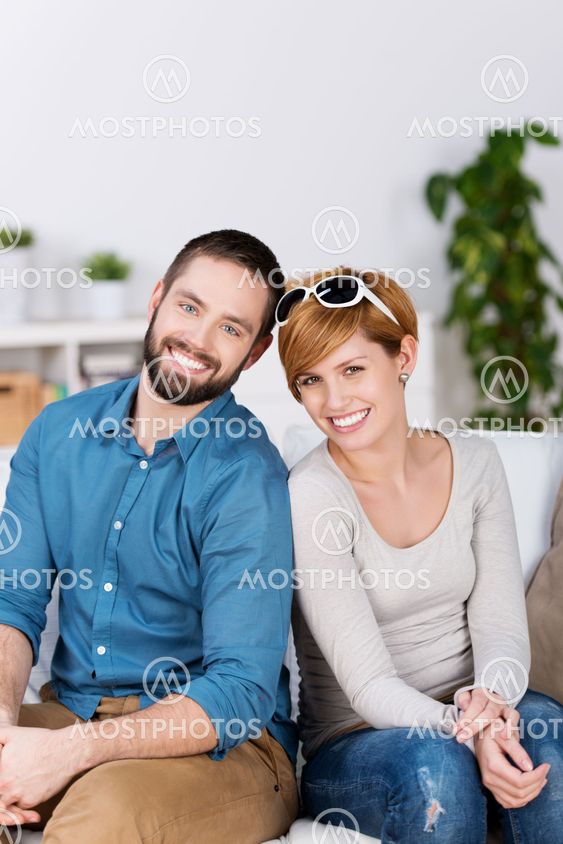 Young Couple Smiling Together In House