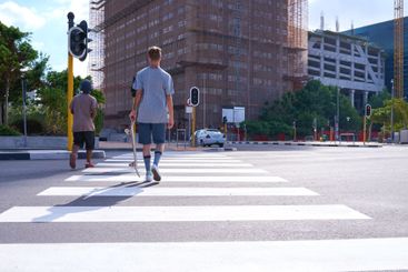 Travel, skateboarder and man in city, road and back of...