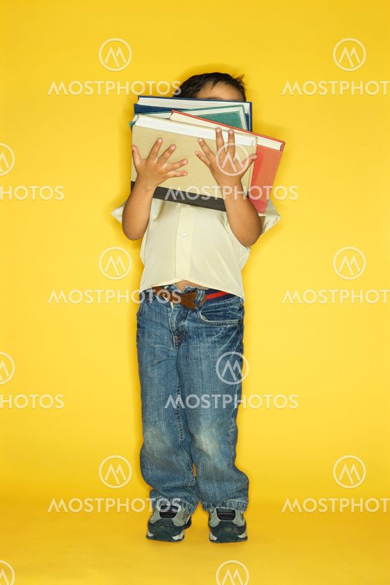 Boy holding books.
