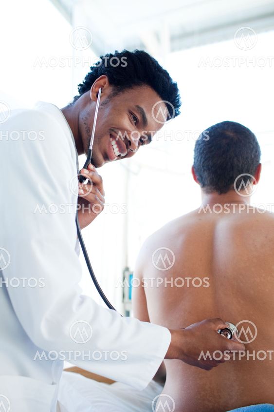 Afro-american doctor attending a male patient
