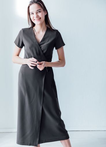 beautiful fashionable slender woman in a gray summer...