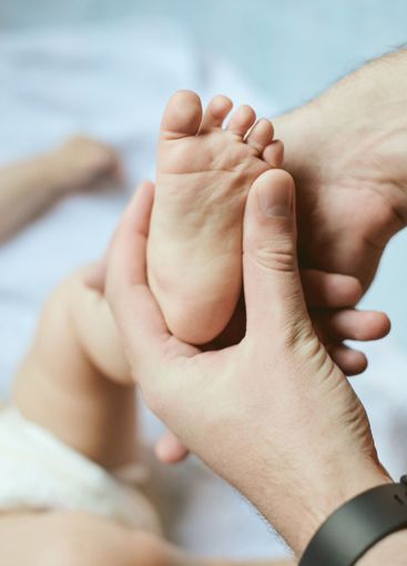 Small, care and parent showing baby feet, newborn human...