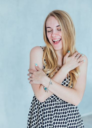 Beautiful fashion blonde woman smiling in summer light...