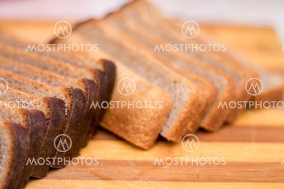 Black rye bread sliced on a wooden board