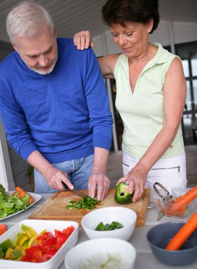 Older couple preparing a meal