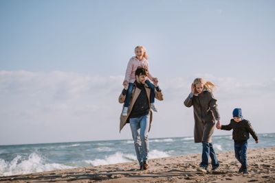 parents and kids on seashore
