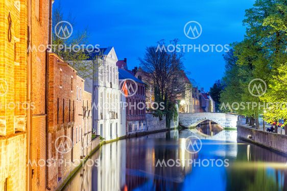Bruges, Belgium. Night view of city canal and medieval...