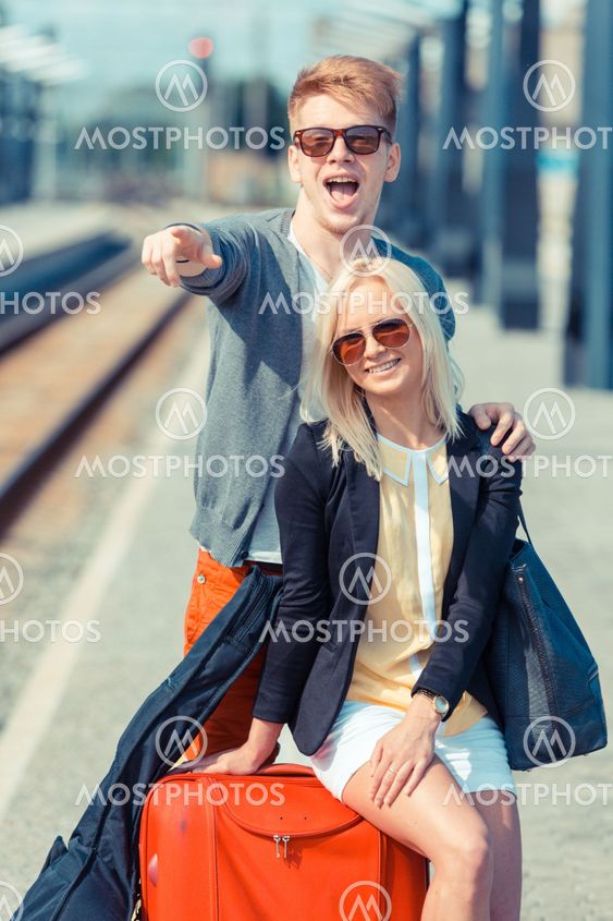 Young Couple Waiting at Train Station