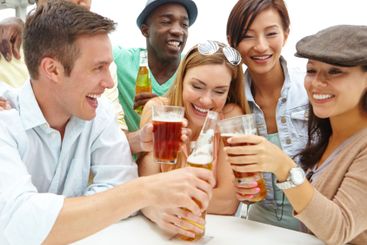 Cheers, celebration and group with alcohol, bar and...