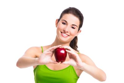 Healthy woman holding an apple