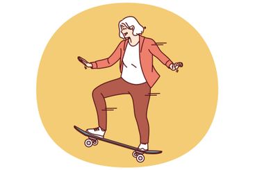 Elderly woman rides skateboard enjoying free time and...