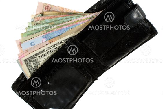 Many banknotes of different countries in the wallet.