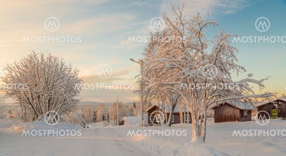 Sunset over winter landscape in Nilivaara, Sweden