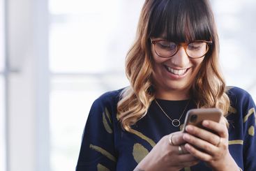 Office, businesswoman and laughing with smartphone for...