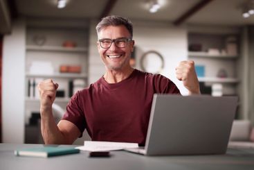 Happy Smiling Man Reading Letter Document