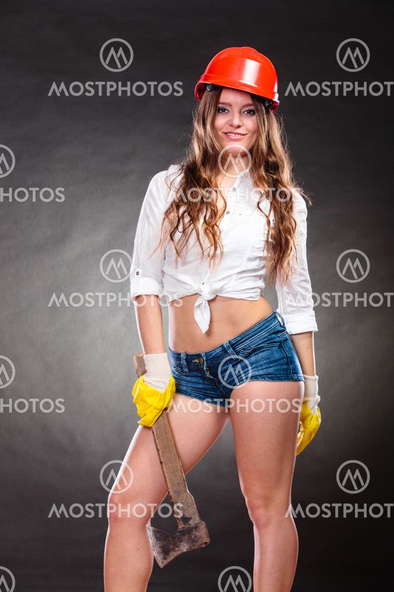 Sexy strong woman feminist with axe working.