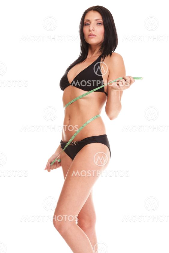 brunette girl bikini measuring waistline tape