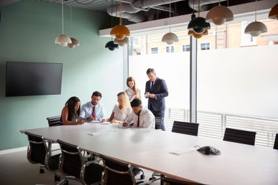 Group Collaborating On Task At Graduate Recruitment...