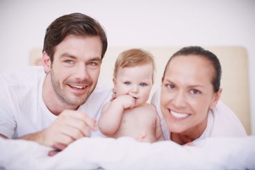Portrait, parents or relax with baby on bed for resting,...