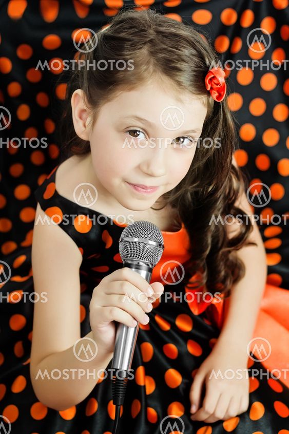Little girl in orange peas dress