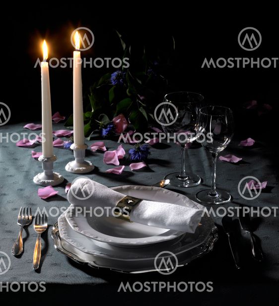 festive place setting and candlelight