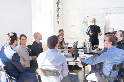 Relaxed informal IT business startup company team meeting.