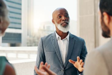 Meeting, advisor and teamwork with business man in city...