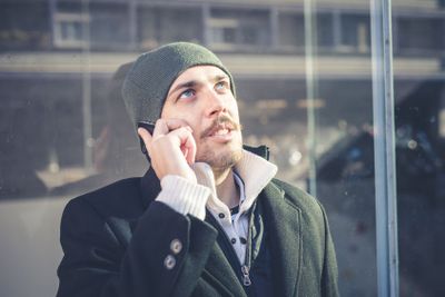 multitasking man using tablet, laptop and cellhpone