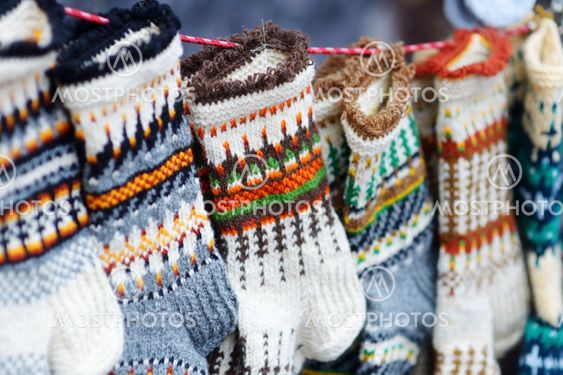 Colorful warm knitted socks sold on Easter market in...