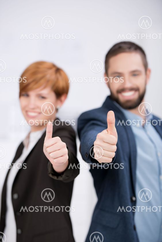 Business Man And Woman Showing Thumbs Up Sign