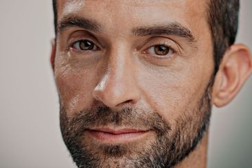 Portrait, skincare and man in studio for natural beauty,...
