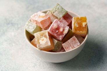 Colorful assortment of traditional confections served in...