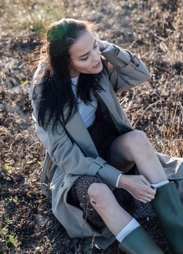 Beautiful fashionable brunette woman in gray coat...