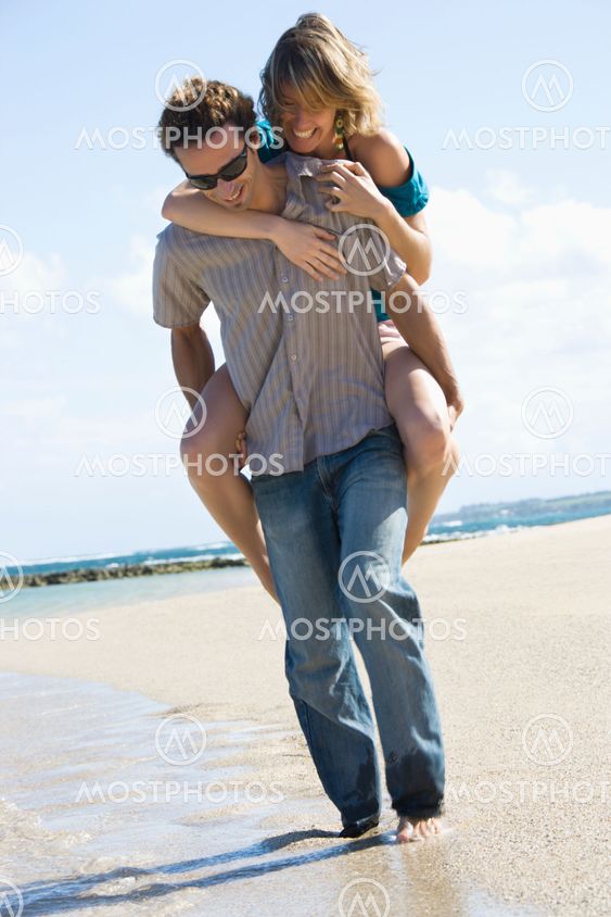 Man carrying woman.