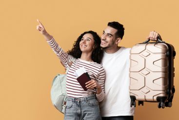 Travel Advertisement. Joyful Arab Couple With Suitcase...