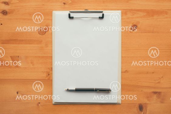 Overhead view of blank clipboard note pad paper with pen