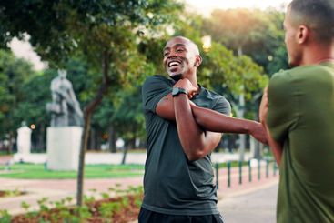 Fitness, stretching and men with routine, outdoor and...