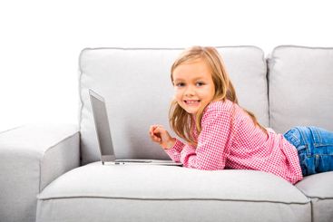 Little girl working with a laptop