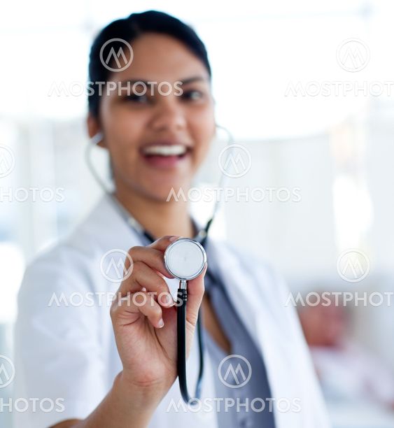 Smiling doctor holding a stethoscope
