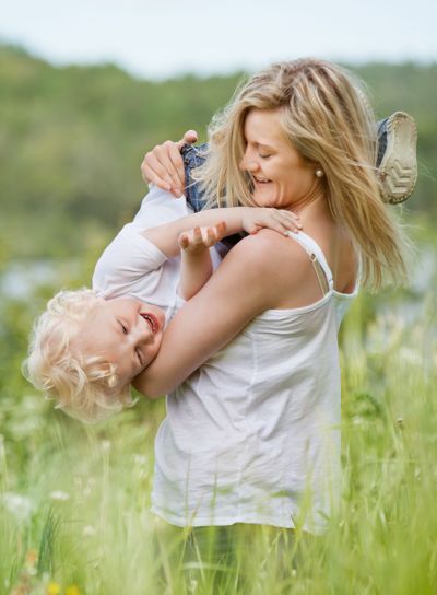 Playful mother with cute child