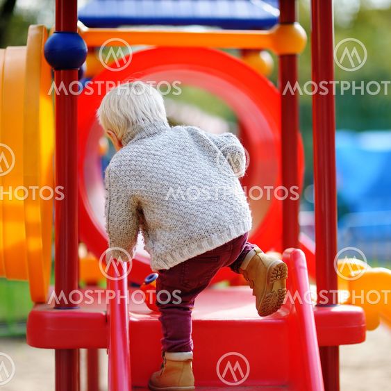 Toddler having fun on playground