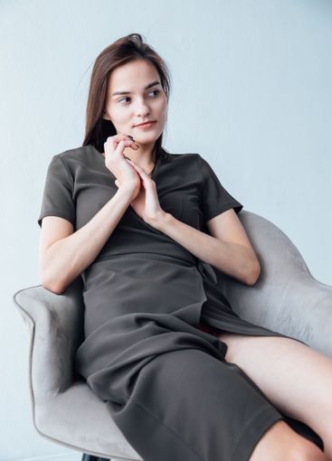 Beautiful Slim Woman in Green Summer Dress on White...