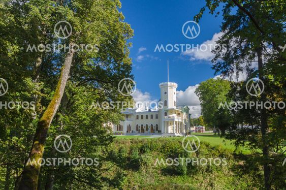 KEILA-JOA, ESTONIA - SEPTEMBER 27, 2015: Keila-Joa manor (Schloss Fall), neo-gothic style building of 19th century standing on hillside under blue sky.