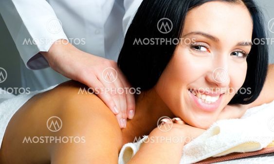 woman receiving facial massage